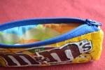 Recycle empty candy wrappers
